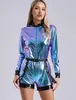 A woman is posing in a metallic jumpsuit. Podgląd zdjęcia produktu