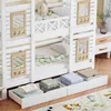 A white bunk bed with storage drawers underneath, featuring a stuffed animal and bedding. Náhľad obrázku produktu