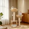 Two cats are relaxing on a multi-level cat tree in a well-lit room with sheer curtains and wooden furniture. Náhľad obrázku produktu