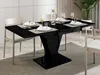 A dining table set up for a meal in a modern dining room. Anteprima dell’immagine prodotto