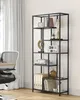 A black metal bookshelf filled with books and decorative items, placed next to a white curtain and a desk chair. Náhled obrázku produktu