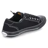 A studio shot of a single black sneaker. Produktbild-Vorschau