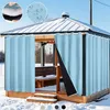 A gazebo covered in snow with light blue curtains hanging. Voir les images du produit