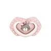 A pink pacifier with a bunny design on a white background. Produktbild-Vorschau