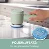 A hand holding a mint-colored electric cleaning brush with a blue scrubbing pad attached, resting on a marble countertop. A separate blue polishing pad is shown next to it. Produktbild-Vorschau