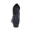A back view of a black boot with a patterned fabric insert at the top. Voir les images du produit