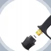 A close-up view of a pressure washer gun attachment point, showing a brass fitting on the gun and a black plastic adapter being connected. Náhled obrázku produktu