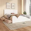 A bedroom scene featuring a bed with storage drawers, two framed pictures on the wall, and a plant in the background. Produktbild-Vorschau