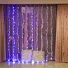 A room decorated with LED string lights and curtains, with two pillows in the foreground. Produktbild-Vorschau
