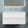 A white bathroom vanity with a sink and faucet, mounted on a light blue textured wall. Produktbild-Vorschau