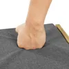 A hand pressing down on a cushion. Produktbild-Vorschau
