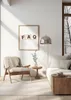 A modern living room scene with a chair, sofa, and side table, bathed in sunlight. Produktbild-Vorschau