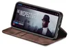 A smartphone in a brown flip case is displayed on a white background, showing a movie playing on the screen. Produktbild-Vorschau
