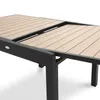 A close-up of an extendable outdoor dining table with a slatted wood-effect top and a black metal frame. Produktbild-Vorschau