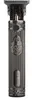A close-up, front-facing studio shot of a dark gray electric trimmer. Náhled obrázku produktu