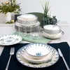 A table setting with a dinnerware set, glasses, and decorative elements. Produktbild-Vorschau