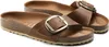 A pair of brown Birkenstock sandals with large buckles, shown from a diagonal angle on a white background. Podgląd zdjęcia produktu