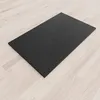 A black shower tray on a light wooden floor. Produktbild-Vorschau
