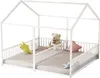 A white house-shaped bed frame with two separate mattress areas, decorated with stuffed animals and pillows. Produktbild-Vorschau