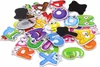 A pile of colorful magnetic alphabet and number toys. Voir les images du produit