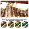 A person sleeping under a faux fur blanket on a bed. Náhled obrázku produktu