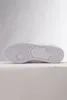 The sole of a white Adidas sneaker is shown against a light gray and white background. Produktbild-Vorschau