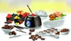 Das Unold-Chocolatier-Set umfasst einen Schmelztiegel, mit Früchten gefüllte Schalen, in Formen gego Produktbild-Vorschau