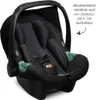 A black baby car seat is shown from a slightly elevated side angle against a white background. Anteprima dell’immagine prodotto