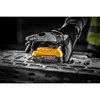A gloved hand holds a DeWalt Powerstack battery over a metal surface. Anteprima dell’immagine prodotto