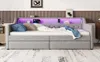 A gray upholstered daybed with built-in ambient lighting and storage drawers. Náhled obrázku produktu