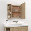 A wooden medicine cabinet is open and mounted on a tiled wall above a sink. Náhled obrázku produktu