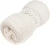 A rolled-up cream-colored fleece blanket with a label around it. Podgląd zdjęcia produktu