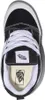A top-down view of a black and white Vans shoe. Voir les images du produit