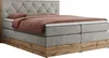 A king-size boxspring bed with a tufted headboard and a wooden base. Produktbild-Vorschau
