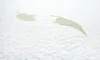 A close-up view of a white mattress with a subtle green leaf pattern. Anteprima dell’immagine prodotto
