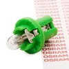 A close-up shot of a green plastic socket with a small light bulb inserted, placed on a white background with a strip of red text reading "OSRAM" repeating in the background. Produktbild-Vorschau