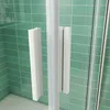 A close-up view of a shower enclosure with green tiled walls. Produktbild-Vorschau