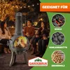 People gathered around a fire pit on a patio at night, with string lights in the background. Anteprima dell’immagine prodotto