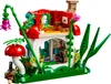 A LEGO Mushroom House set with surrounding foliage. Voir les images du produit