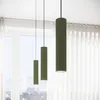 Three green cylindrical pendant lights hanging in front of a window with sheer curtains. Voir les images du produit