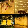 A collage of four images showing string lights used for decoration in various settings, including on a wall with flowers, above a bed, on a swing set, and on a wall with wooden flooring. Náhled obrázku produktu