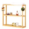 A three-tiered bamboo shelf unit displaying various cosmetic and personal care items. Náhled obrázku produktu
