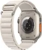 The back of an Apple Watch Ultra with an Alpine Loop band is shown against a white background. Produktbild-Vorschau
