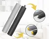 Two vacuum cleaner roller brushes displayed diagonally, with close-up circular insets showing details of the brush ends. The background suggests a modern living room with white furniture. Produktbild-Vorschau