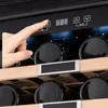 A hand is shown pressing a button on the control panel of a wine cooler, with bottles visible inside. Produktbild-Vorschau