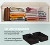 A storage bench filled with folded blankets and hats, with two empty storage boxes shown below. Anteprima dell’immagine prodotto