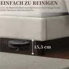 A robot vacuum cleaner is shown cleaning under a bed frame, illustrating the bed's clearance. Produktbild-Vorschau