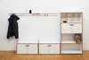 A modern entryway setup with storage units and a coat rack. Produktbild-Vorschau