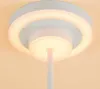 Close-up view of a modern ceiling light fixture with a circular design and integrated LED lighting. Produktbild-Vorschau