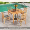 A wooden table and chairs set up by a swimming pool, with an umbrella providing shade. Anteprima dell’immagine prodotto